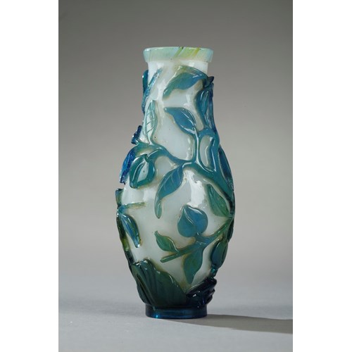 Small vase overlay glass turquoise blue, green on ground white opaque decorated with longevity peach and foliage